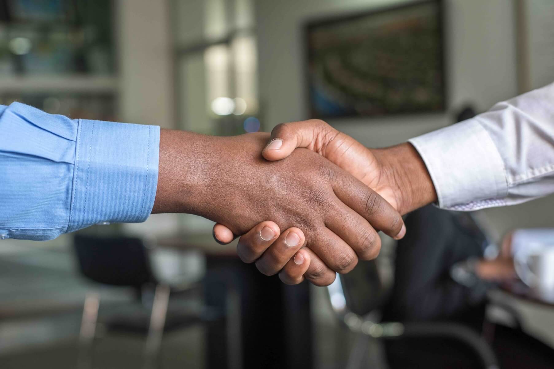 Two people shaking hands.